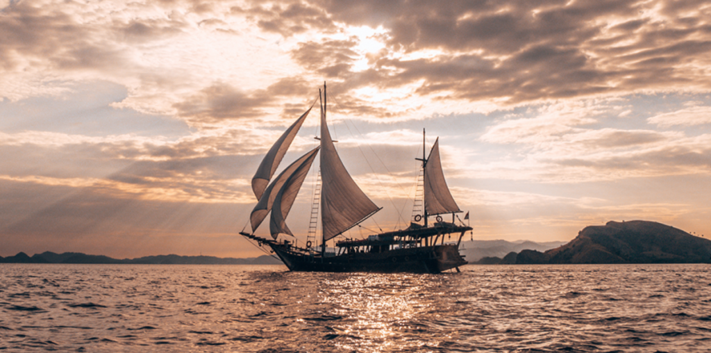 yacht charter indonesia with sunset and sunrise view